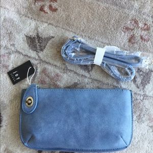Blue suede clutch with wristlet and purchase strap
